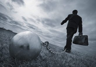 Businessman With Ball And Chain